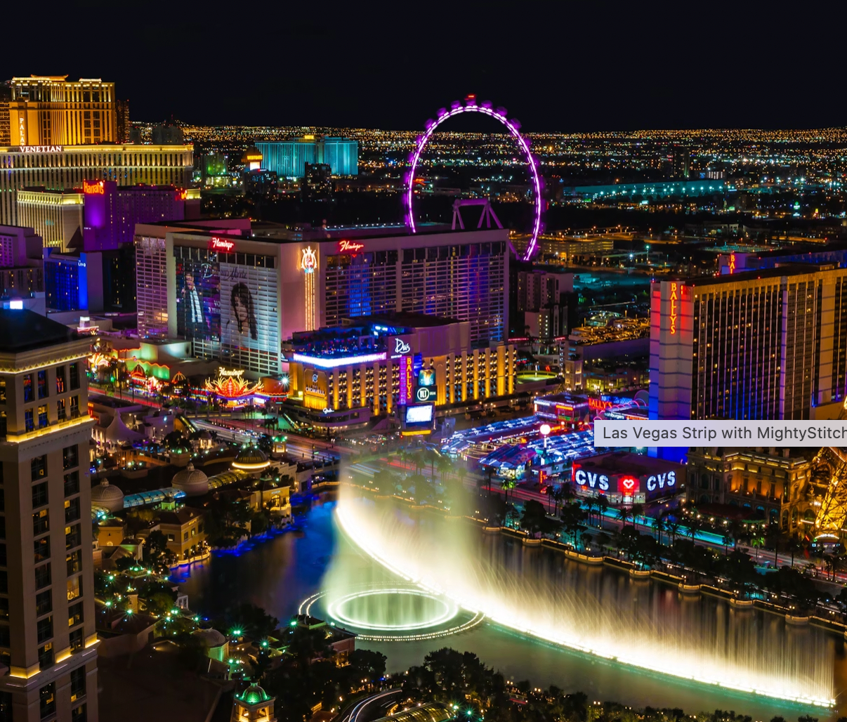 Las Vegas Strip at night with illuminated buildings and fountain show. MightyStitch.com